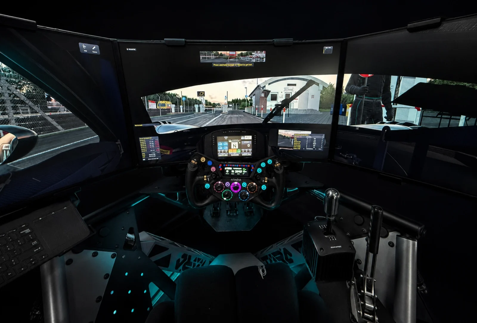 TORQ EVO 2 cockpit with triple-screen sim racing setup